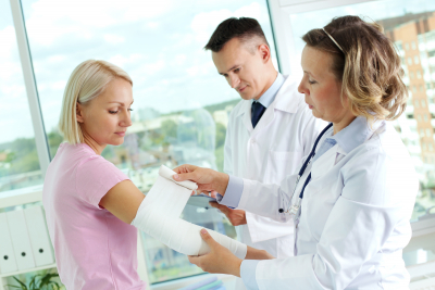 doctors giving first aid to an adult woman