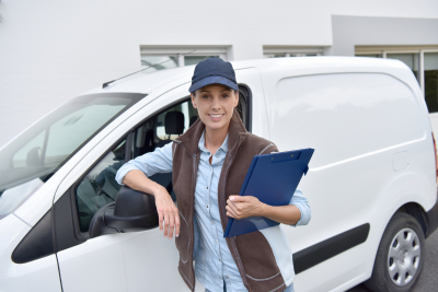 delivery woman standing in the van